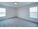 Simple bedroom with carpet and large windows at 2613 Plyler Mill Rd, Monroe, NC 28112