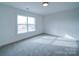 Bedroom with window and carpet at 2613 Plyler Mill Rd, Monroe, NC 28112