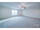 Large bedroom with ceiling fan and window at 2613 Plyler Mill Rd, Monroe, NC 28112