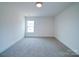 Well-lit bedroom with carpet and a window offering natural light at 2613 Plyler Mill Rd, Monroe, NC 28112