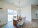 Bright dining area with hardwood floors and sliding glass doors to patio at 2613 Plyler Mill Rd, Monroe, NC 28112