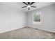 Bright bedroom with ceiling fan and neutral carpeting at 2909 Eastway Dr, Statesville, NC 28625