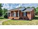 Brick ranch home with covered porch at 2909 Eastway Dr, Statesville, NC 28625