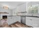 Modern kitchen with white cabinets, stainless steel appliances, and breakfast bar at 2909 Eastway Dr, Statesville, NC 28625