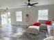 Living room featuring grey sectional sofa and ceiling fan at 2909 Eastway Dr, Statesville, NC 28625