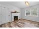 Living room with fireplace and neutral color palette at 2909 Eastway Dr, Statesville, NC 28625