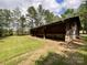 Long wooden barn in a grassy area at 4300 Daniel Dr, Waxhaw, NC 28173