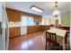 Bright kitchen features wood cabinets, appliances, and hardwood floors at 4300 Daniel Dr, Waxhaw, NC 28173