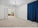 Spacious finished basement featuring carpeted flooring, chandelier lighting, and an adjacent sitting room through french doors at 927 Dericks Xing, Fort Mill, SC 29708