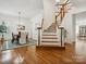 Beautiful staircase in the entry way alongside a dining area with great natural light at 927 Dericks Xing, Fort Mill, SC 29708
