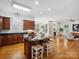 Open concept kitchen with granite countertops, seating island and stainless steel appliances at 927 Dericks Xing, Fort Mill, SC 29708