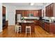 Well-lit kitchen features granite countertops, stainless steel appliances, and a stylish center island at 927 Dericks Xing, Fort Mill, SC 29708