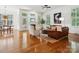 Spacious living room with fireplace, plantation shutters, hardwood floors and comfortable seating at 927 Dericks Xing, Fort Mill, SC 29708