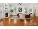 Bright living room with hardwood floors, fireplace, plantation shutters, and comfortable seating at 927 Dericks Xing, Fort Mill, SC 29708