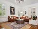 Comfortable living room featuring hardwood floors, twin couches and lots of natural light at 927 Dericks Xing, Fort Mill, SC 29708