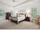 Bright main bedroom with large windows, neutral tones, and elegant furnishings at 927 Dericks Xing, Fort Mill, SC 29708
