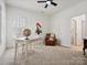 Bright office space with white desk, leather chair, and large windows with shutters at 927 Dericks Xing, Fort Mill, SC 29708