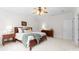 Cozy bedroom with plush carpeting, ceiling fan, and natural light from the window at 160 Northington Woods Dr, Mooresville, NC 28117