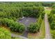 Aerial shot of a boat storage lot surrounded by trees in a gated community, a great amenity for boating enthusiasts at 160 Northington Woods Dr, Mooresville, NC 28117