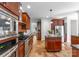 Modern kitchen with stainless steel appliances and dark wood cabinetry at 160 Northington Woods Dr, Mooresville, NC 28117