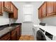 Laundry room with sink, granite counters, and cabinets above at 160 Northington Woods Dr, Mooresville, NC 28117