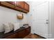 Mud room featuring a bench and upper cabinets for storage at 160 Northington Woods Dr, Mooresville, NC 28117