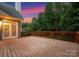 Spacious wooden deck featuring railing, stairs to the yard, and perfect for outdoor entertaining at 160 Northington Woods Dr, Mooresville, NC 28117