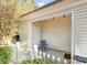 Enclosed patio with string lights offering a charming outdoor retreat with white picket fence at 12229 Savannah Garden Dr, Charlotte, NC 28273