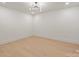 Bright bedroom featuring recessed lighting, a stylish chandelier and wood flooring at 626 Concord Rd, Davidson, NC 28036