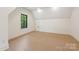 Bright and airy bedroom with hardwood floors, a large window, and ample space at 626 Concord Rd, Davidson, NC 28036