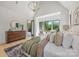 Spacious main bedroom offering ample natural light, neutral decor, and views of the outdoors at 626 Concord Rd, Davidson, NC 28036