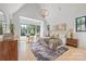 Light-filled main bedroom with neutral tones, stylish decor, and black-trimmed windows at 626 Concord Rd, Davidson, NC 28036