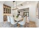 Elegant dining room with access to the living room, and a modern chandelier at 626 Concord Rd, Davidson, NC 28036
