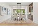 Dining area with a modern chandelier, bar cabinet, and large windows with a view at 626 Concord Rd, Davidson, NC 28036