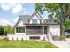 Beautiful home featuring a screened-in porch and well-maintained lawn at 626 Concord Rd, Davidson, NC 28036