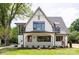 Charming two-story home with landscaped yard and inviting covered entryway at 626 Concord Rd, Davidson, NC 28036