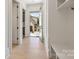 Bright hallway with open access to the outdoors and built-in storage options at 626 Concord Rd, Davidson, NC 28036