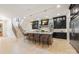 Open gourmet kitchen with a large center island, modern pendant lighting, and premium stainless appliances at 626 Concord Rd, Davidson, NC 28036