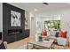 Cozy living room with a modern fireplace, stylish decor, and an open view to the dining area at 626 Concord Rd, Davidson, NC 28036