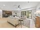 Open concept living area features stylish couches, light wood floors, and access to a home bar at 626 Concord Rd, Davidson, NC 28036