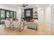 Cozy living room featuring a fireplace with dark wood surround and sliding glass doors at 626 Concord Rd, Davidson, NC 28036