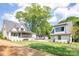 Exterior view showcasing the house with lush lawn and mature trees at 626 Concord Rd, Davidson, NC 28036