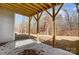 Partially covered patio with wooden supports and view of wooded area at 5031 Mclaughlin Loop # 60, Waxhaw, NC 28173