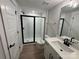 Clean bathroom with white subway tile shower, black frame, and vanity at 5031 Mclaughlin Loop # 60, Waxhaw, NC 28173