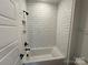 Clean bathroom with white subway tile and bathtub at 5031 Mclaughlin Loop # 60, Waxhaw, NC 28173