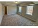 Spacious bedroom with carpet, large windows, and a walk-in closet at 5031 Mclaughlin Loop # 60, Waxhaw, NC 28173