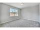 Cozy bedroom with grey carpet and a view at 5031 Mclaughlin Loop # 60, Waxhaw, NC 28173