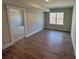 Bright bedroom with hardwood floors and a view into another room at 5031 Mclaughlin Loop # 60, Waxhaw, NC 28173