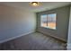 Bright bedroom with carpet and large window at 5031 Mclaughlin Loop # 60, Waxhaw, NC 28173