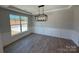 Formal dining room with hardwood floors, wainscoting, and a chandelier at 5031 Mclaughlin Loop # 60, Waxhaw, NC 28173